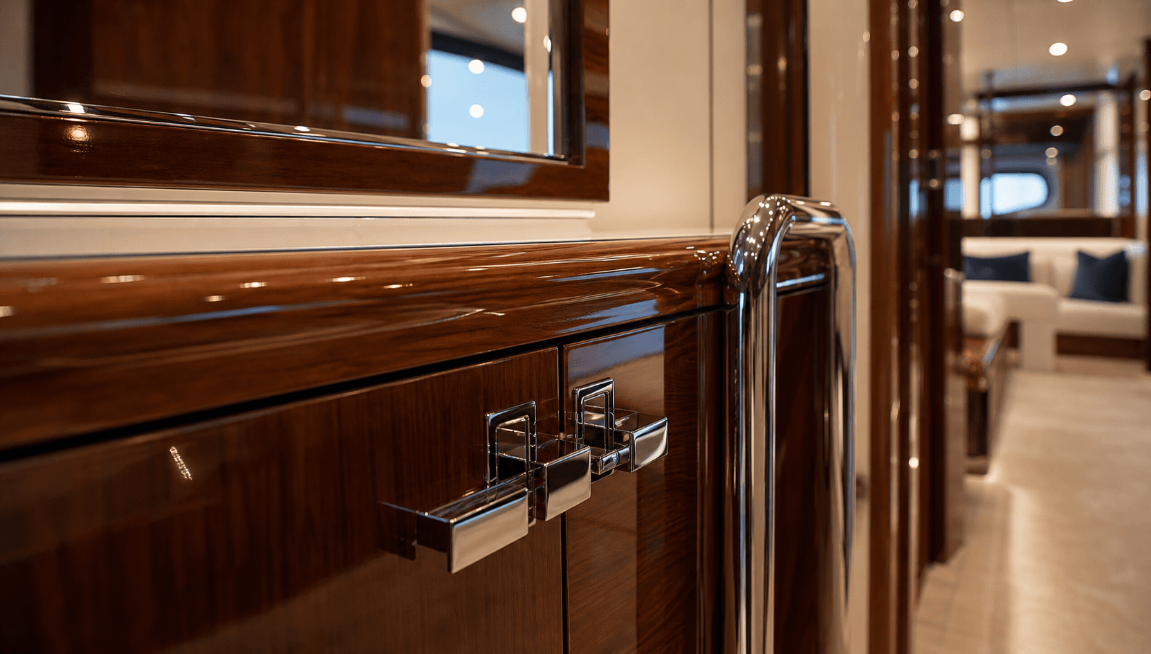 Polished yacht interior wood trim and metal hardware details